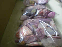 Assorted pink rocks, often dyed, 4 ounce bags. Inc