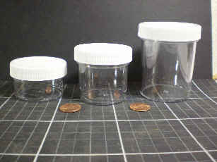 Clear plastic wide mouthed jars with white plastic